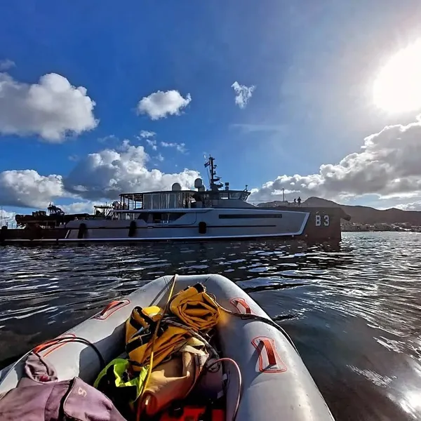 Cylipso Diving dive tender on the water beside a superyacht in Sint Maarten